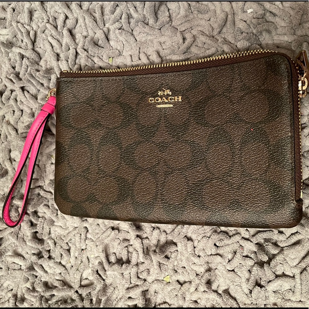 Brown and pink coach wristlet (new with care card)